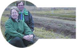 Picture of Sue and Tim with first-year trees in the ground
